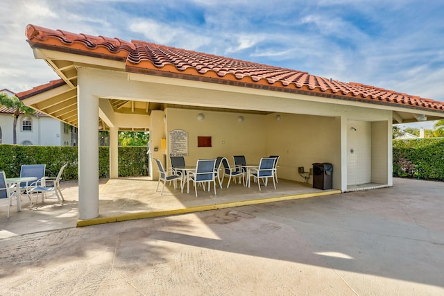 back of property with a patio