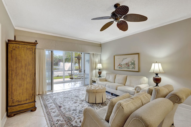 living room with light tile patterned floors, a textured ceiling, ceiling fan, and crown molding