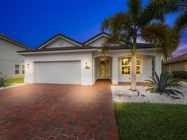 view of front of property with a garage