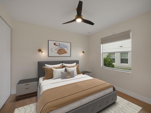 bedroom featuring ceiling fan and light hardwood / wood-style flooring