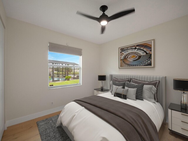 bedroom with ceiling fan and light hardwood / wood-style flooring