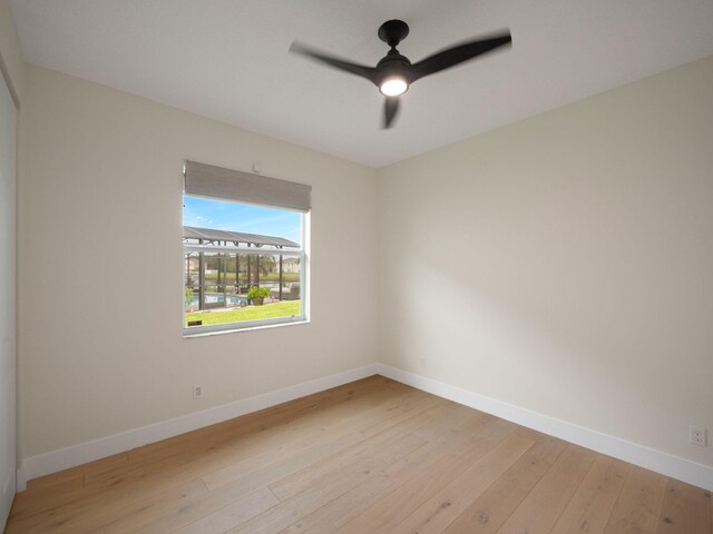 unfurnished room with light wood-type flooring and ceiling fan