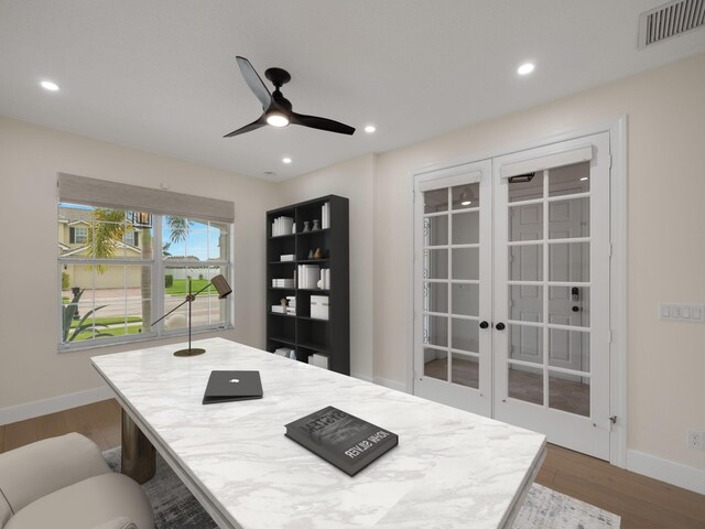 office area featuring hardwood / wood-style floors, ceiling fan, and french doors