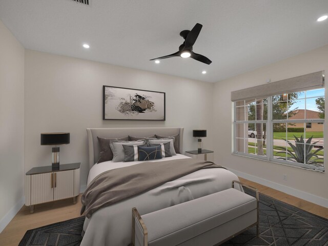 bedroom featuring ceiling fan and wood-type flooring