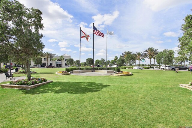 view of home's community with a lawn