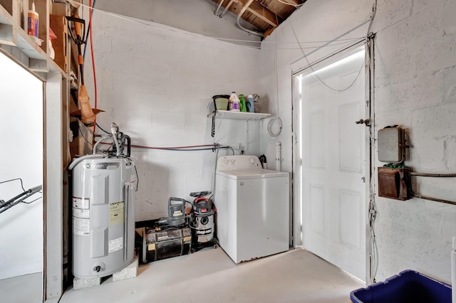 interior space featuring electric water heater and washer / dryer