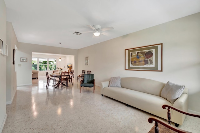 living room featuring ceiling fan