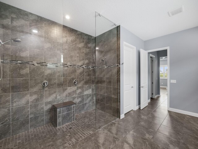 bathroom with a tile shower