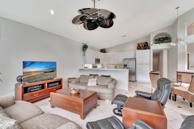 living room featuring ceiling fan, light tile patterned flooring, and high vaulted ceiling