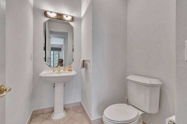 bathroom featuring tile patterned flooring and toilet