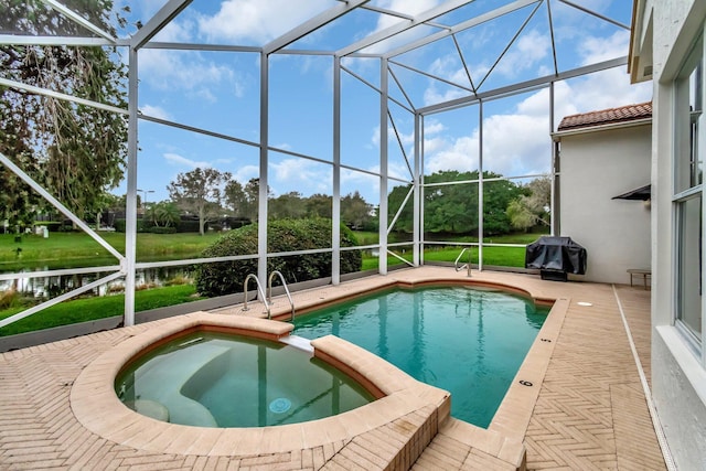 view of pool featuring a lanai, a grill, a patio area, and an in ground hot tub