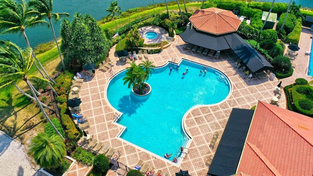 view of pool featuring a water view