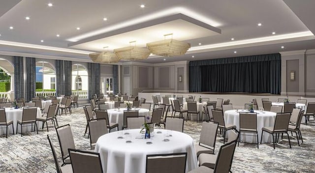 carpeted dining area with a tray ceiling