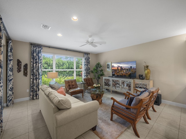 living room featuring ceiling fan and light tile patterned floors