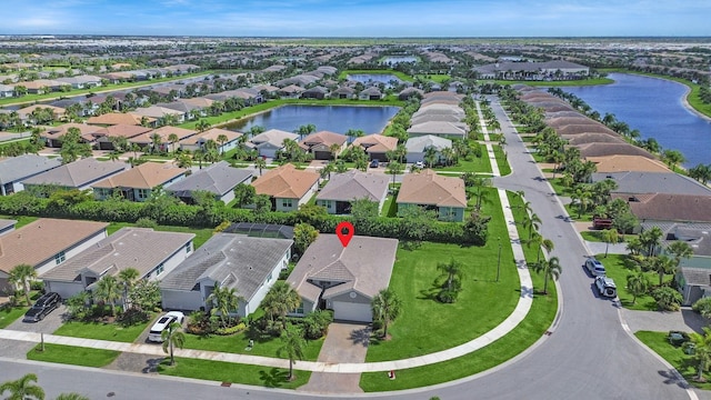 birds eye view of property featuring a water view