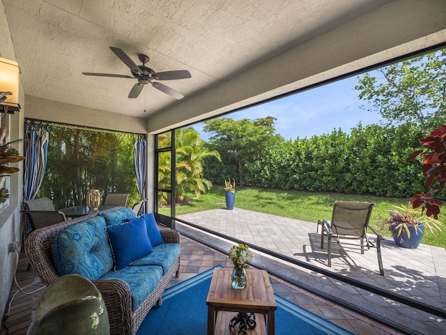 view of patio with ceiling fan and an outdoor living space