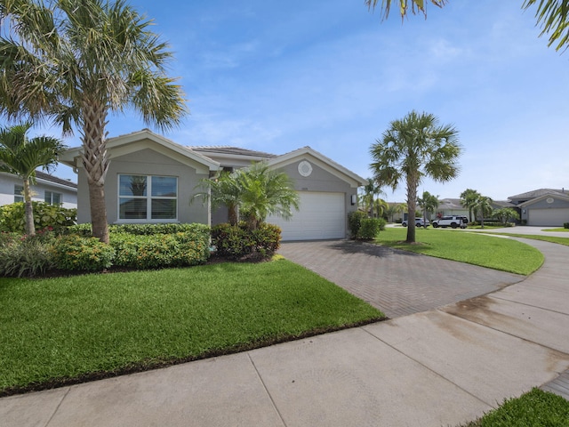 single story home featuring a front yard and a garage