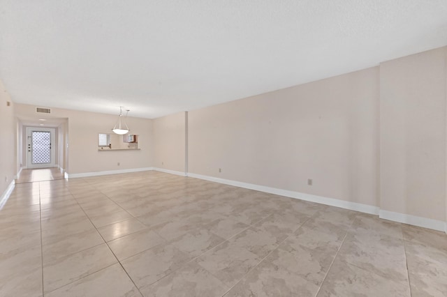 view of tiled spare room