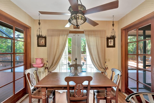 dining area with ceiling fan, french doors, and hardwood / wood-style flooring