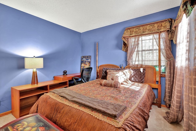 carpeted bedroom featuring a textured ceiling