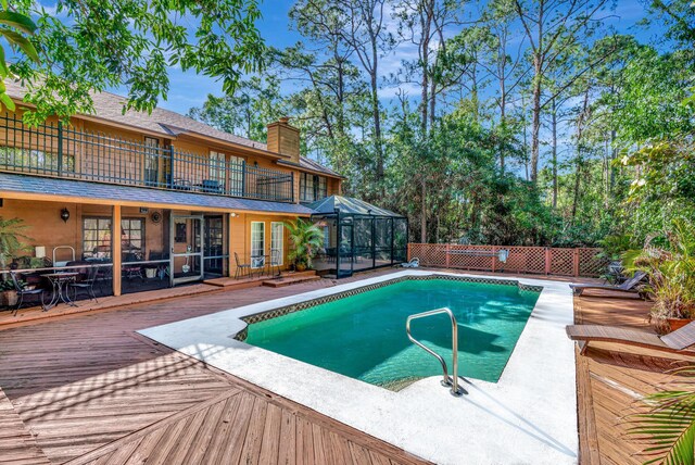 view of pool featuring a wooden deck