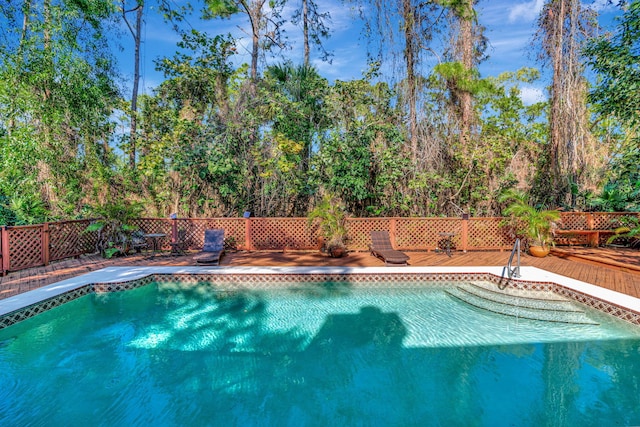 view of swimming pool featuring a deck