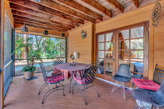 sunroom with beam ceiling and wood ceiling