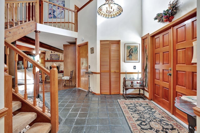 entryway featuring a high ceiling and a chandelier