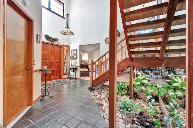 foyer with a towering ceiling