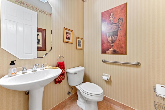 bathroom featuring tile patterned floors and toilet