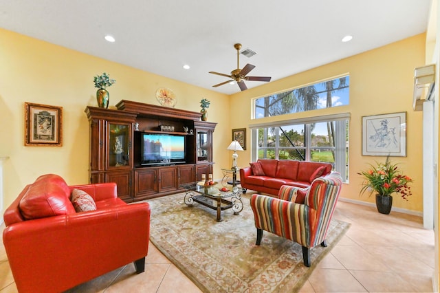 tiled living room featuring ceiling fan