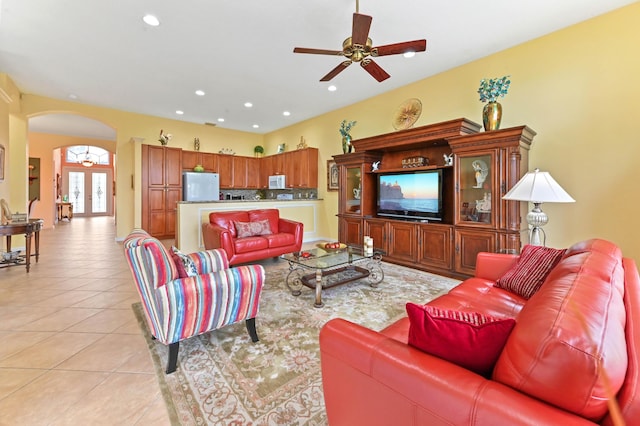 living room with ceiling fan, french doors, and light tile patterned floors