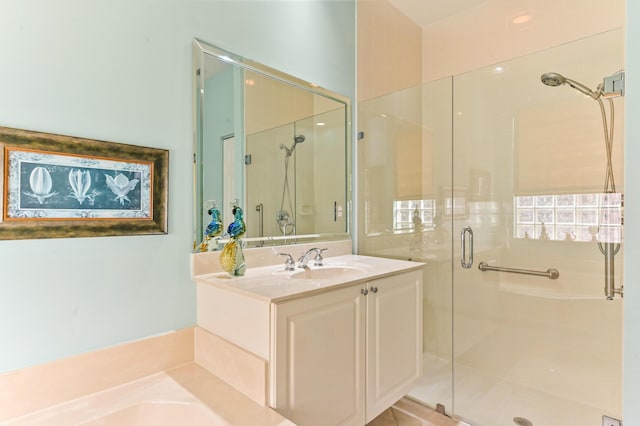 bathroom featuring vanity and a shower with door