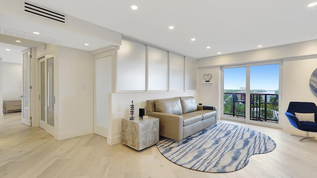 living room with light hardwood / wood-style flooring