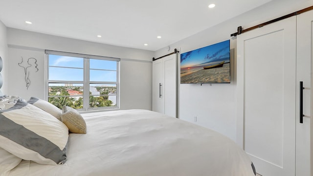 bedroom with a barn door