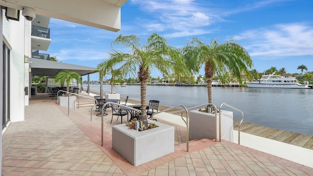 view of patio with a water view