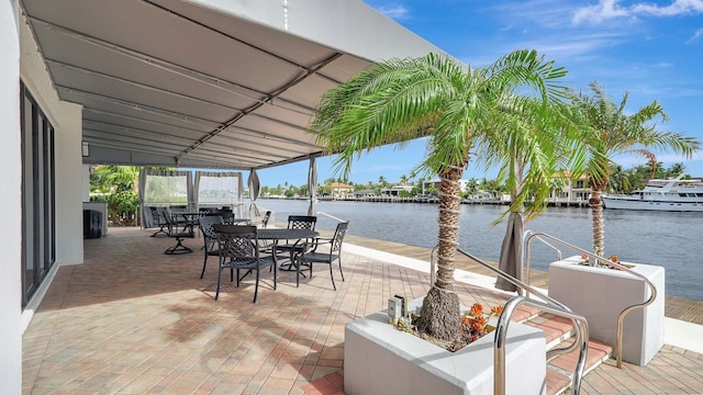 view of patio with a water view