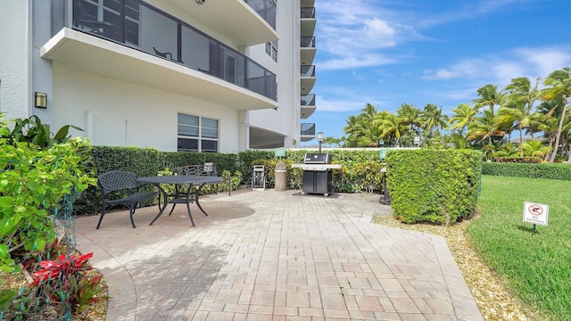 view of patio featuring a grill