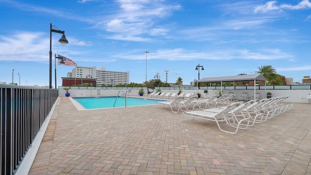 view of swimming pool featuring a patio area