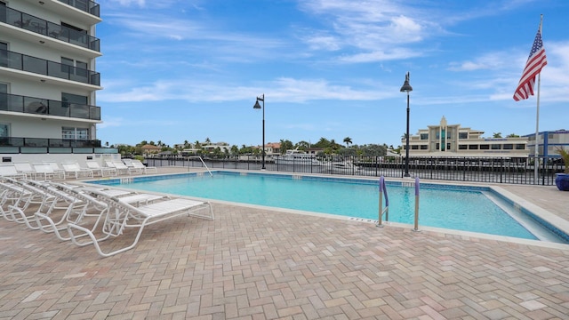 view of swimming pool with a patio area