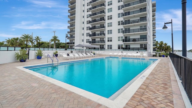 view of swimming pool with a patio area