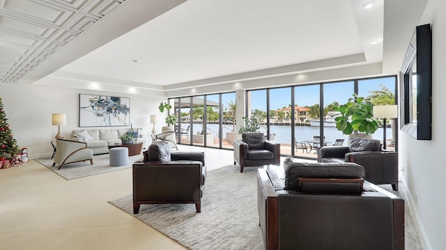 tiled living room with a water view