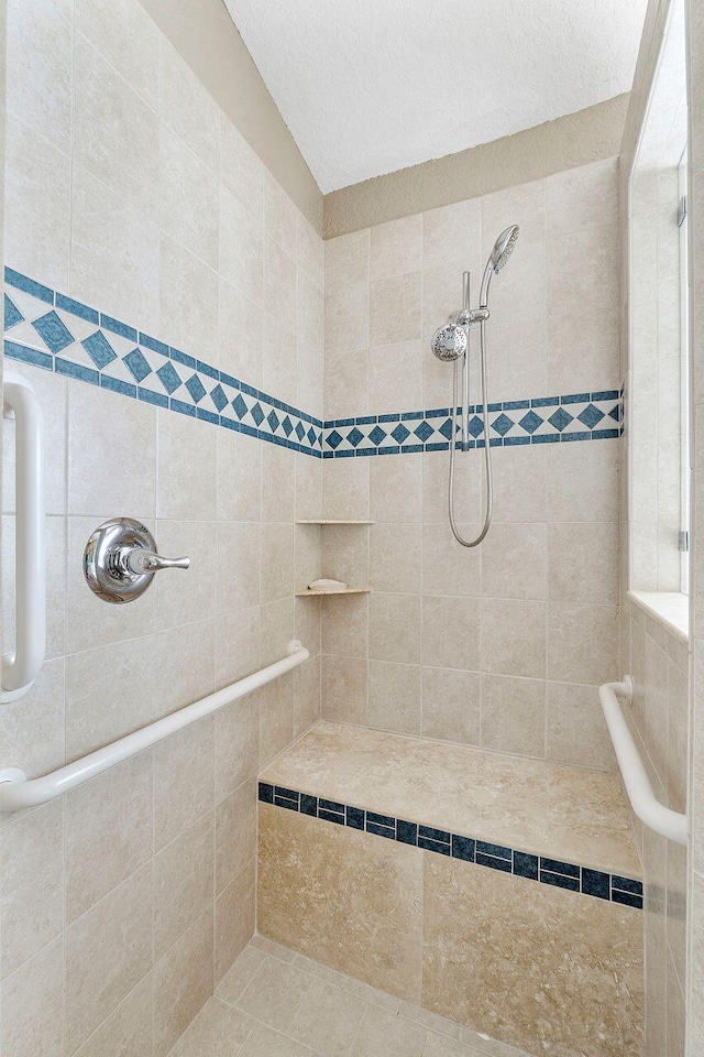 bathroom featuring tiled shower