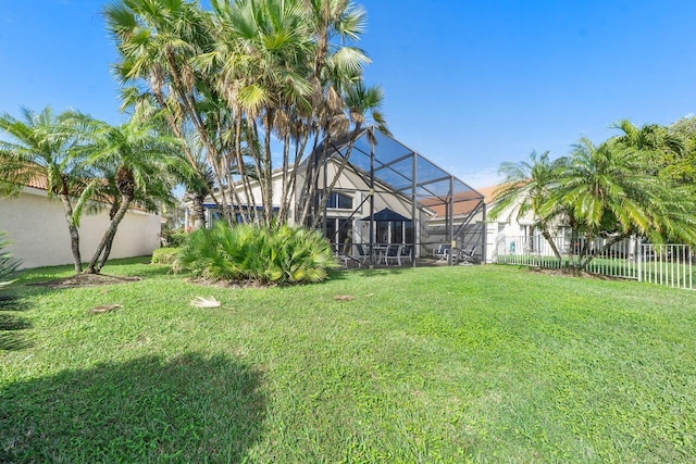 view of yard featuring glass enclosure