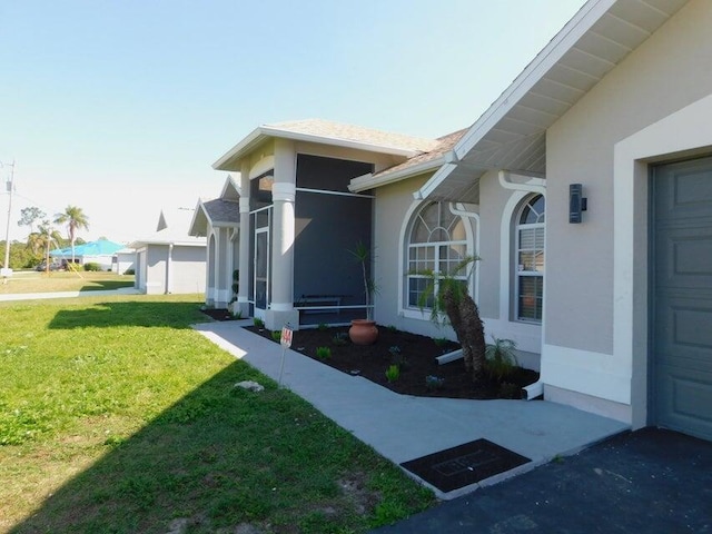 view of home's exterior with a lawn