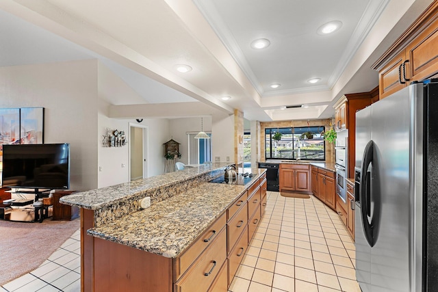 kitchen featuring light tile patterned floors, crown molding, black appliances, a center island with sink, and a raised ceiling