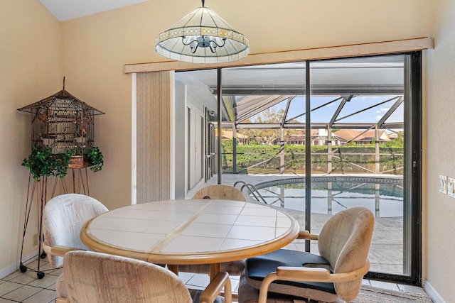 dining area with light tile patterned flooring