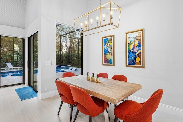 dining area featuring an inviting chandelier