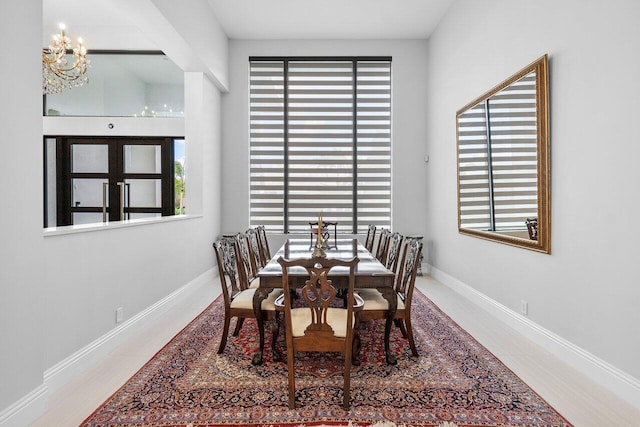 dining space featuring an inviting chandelier