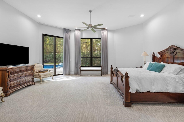 bedroom with ceiling fan, access to exterior, and light colored carpet